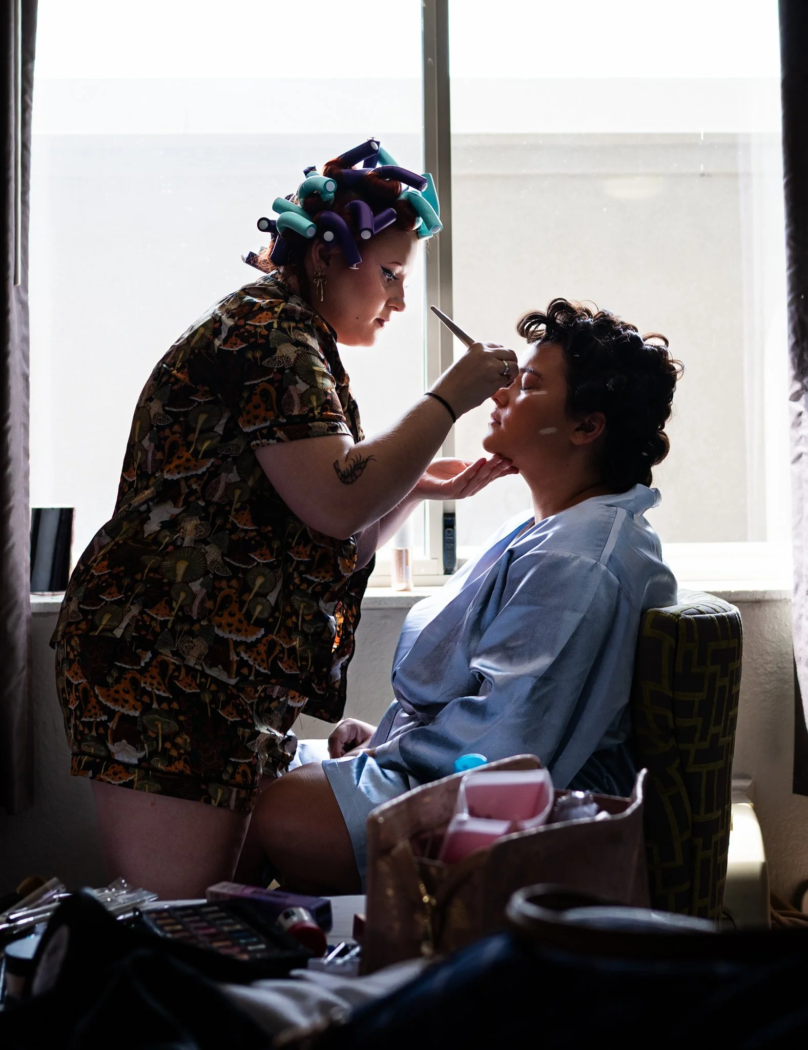 Cree Anders prepares her older sister Audia's makeup before Audia's wedding ceremony May 30th. 