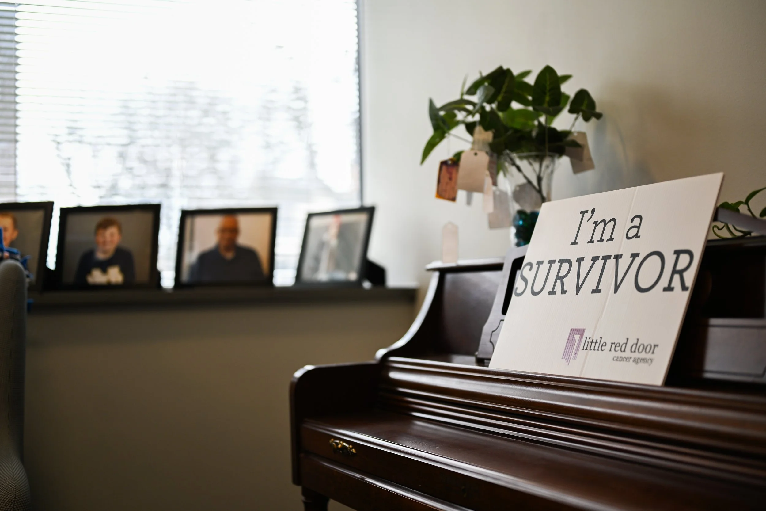 A sign displayed in the Indianapolis office of Little Red Door Cancer Agency during the nonprofit’s open house event Feb. 19 in Indianapolis. Little Red Door’s services are offered to clients beyond their cancer remission.