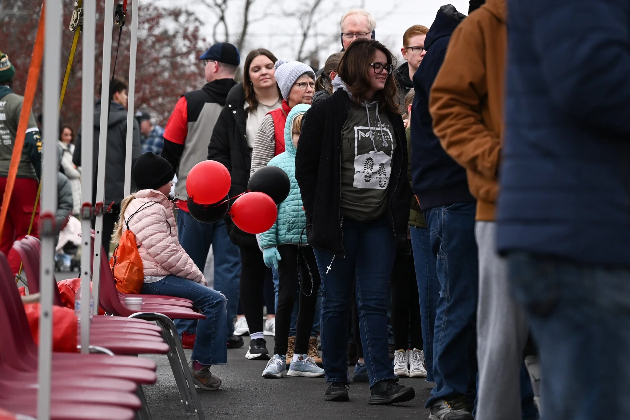 Attendees of the Muncie Mission Walk a Mile in My Shoes event line up for refreshments after the walk Feb. 21 in Muncie, Indiana. 