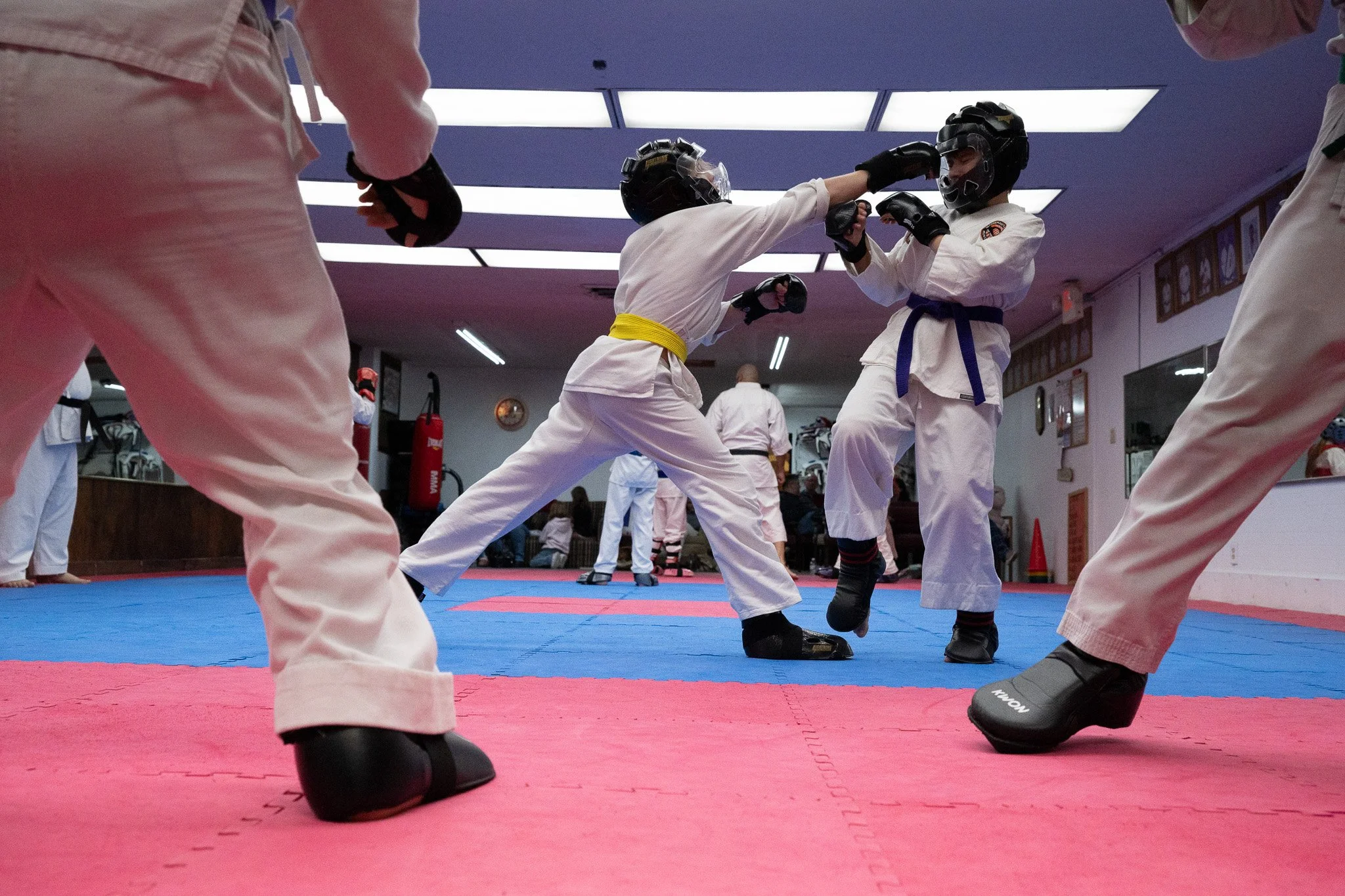 Students of all ages and experience levels test their skills against one another during a sparring session at Foreman's Karate studio November 2025 in Muncie, Indiana. 