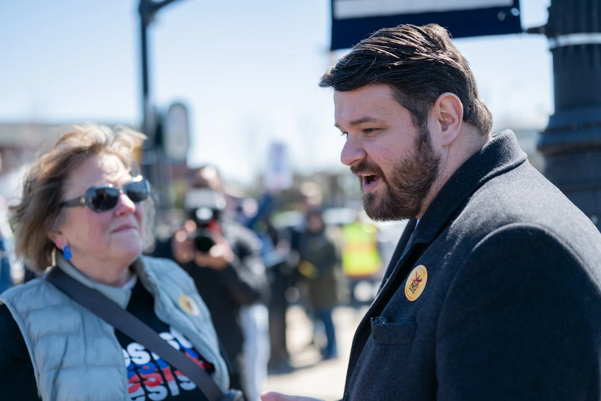 State Sen. J.D. Ford speaks with a protester during the ‘No Kings 3’ protest March 28 at the Fallen Heroes Memorial Bridge.