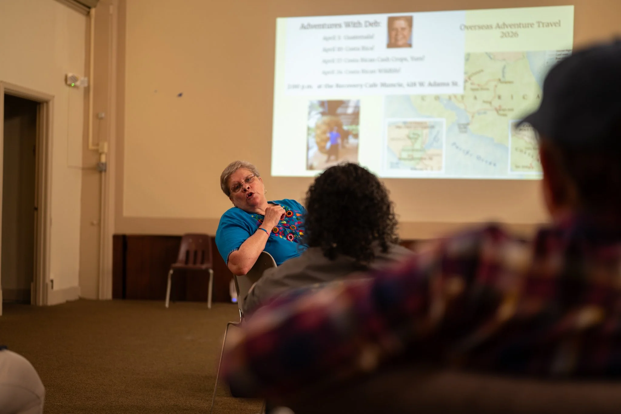 Recovery Cafe Muncie volunteer Deb presents information about her recent trip to Guatemala to the guests at the cafe April 3 in Muncie, Indiana. Deb is a retiree and spends much of her free time traveling. When she returns, she presents her trips to 