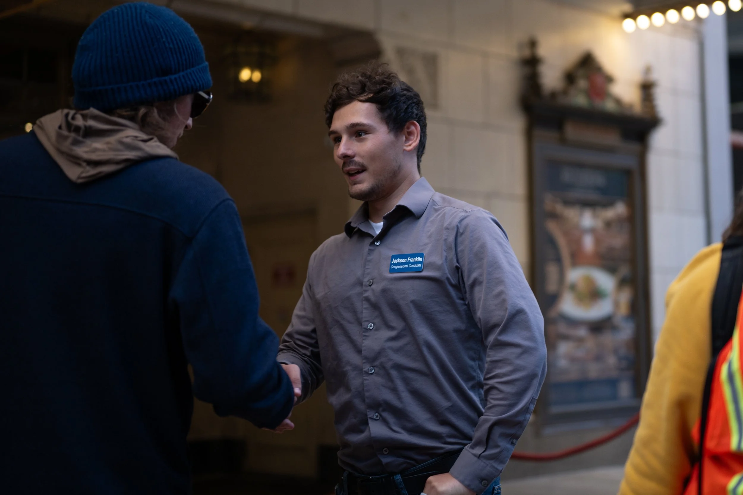 Jackson Franklin, a Muncie local candidate running for Congress in Indiana's District 5, greeting a protestor during a rally October 2025 at the Indiana Roof Ballroom. 