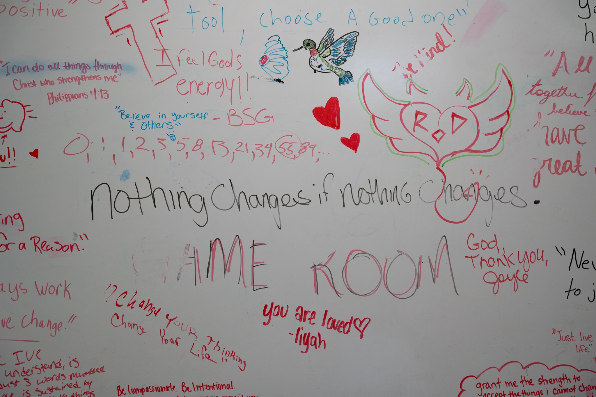 A decorated whiteboard in the game room of Recovery Café Muncie pictured April 4 in Muncie, Indiana. Recovery Café is a national nonprofit service that offers rehabilitation services for members of the community. Many of the employees and volunteers 
