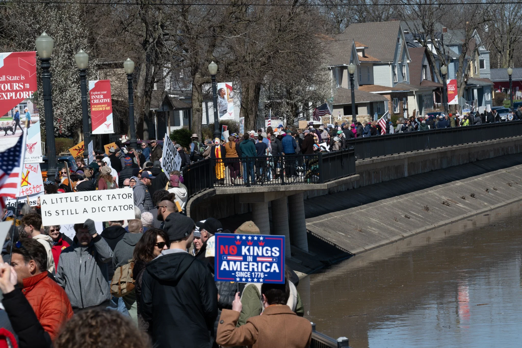 Protesters stand along Wheeling Avenue during the ‘No Kings 3’ protest March 28 in downtown Muncie.