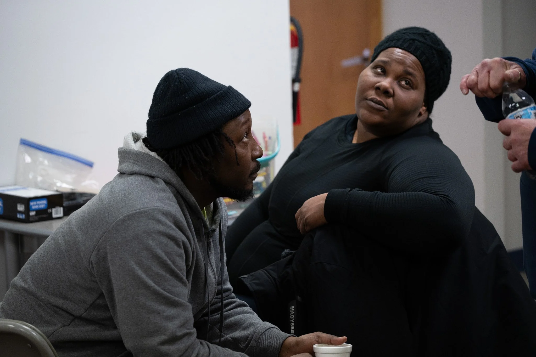 Married couple Brionna and Dion, who are clients of the Price Hall Warming Center, speak with another client of the shelter Feb. 2 at Price Hall. Brionna is a volunteer at the center and was recently hired by the Muncie Housing Authority (MHA) as pro