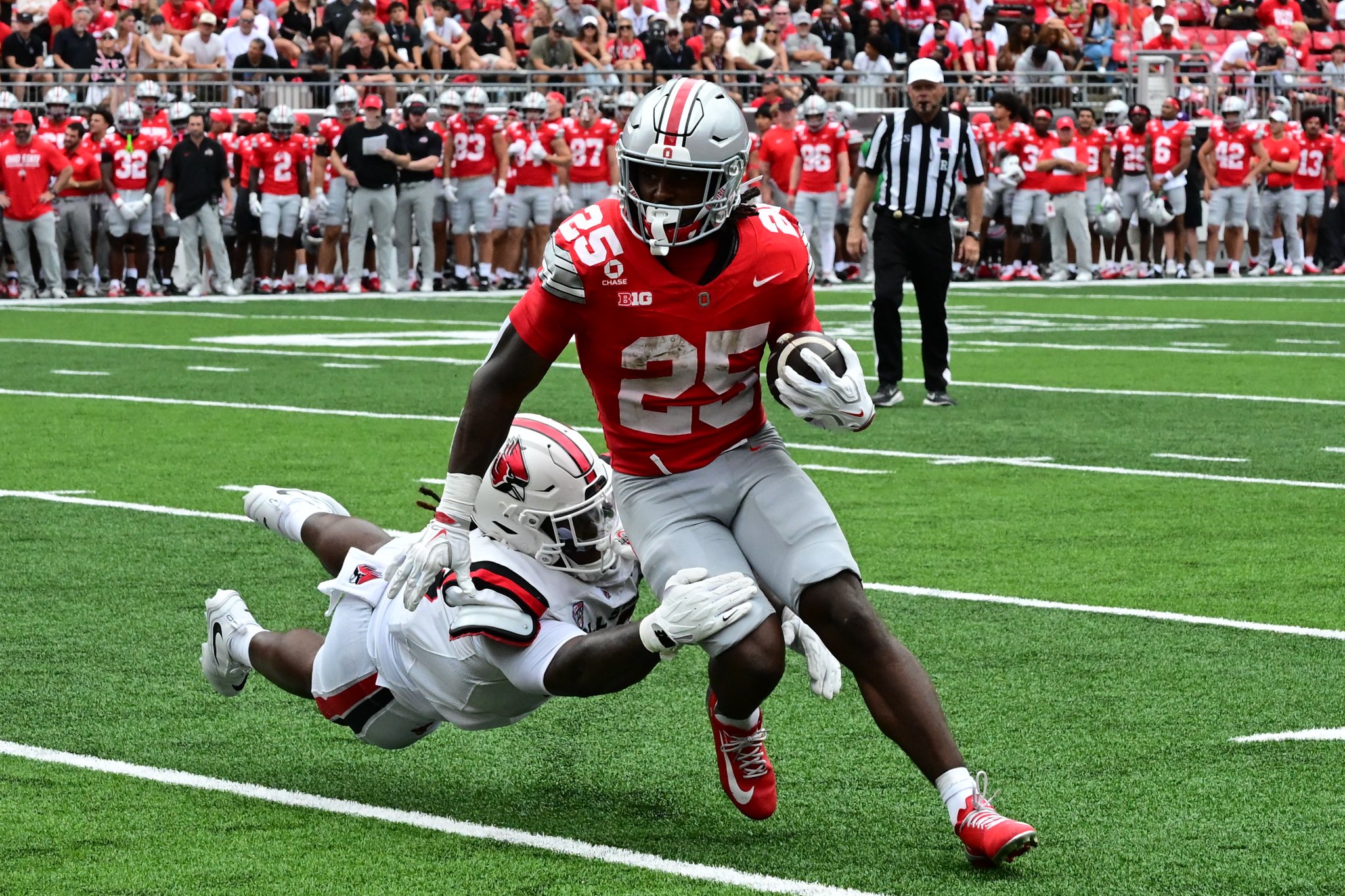 Ohio State University second-year running back Bo Jackson runs through a Ball State University defensive player Sept. 5 at Ohio Stadium. 