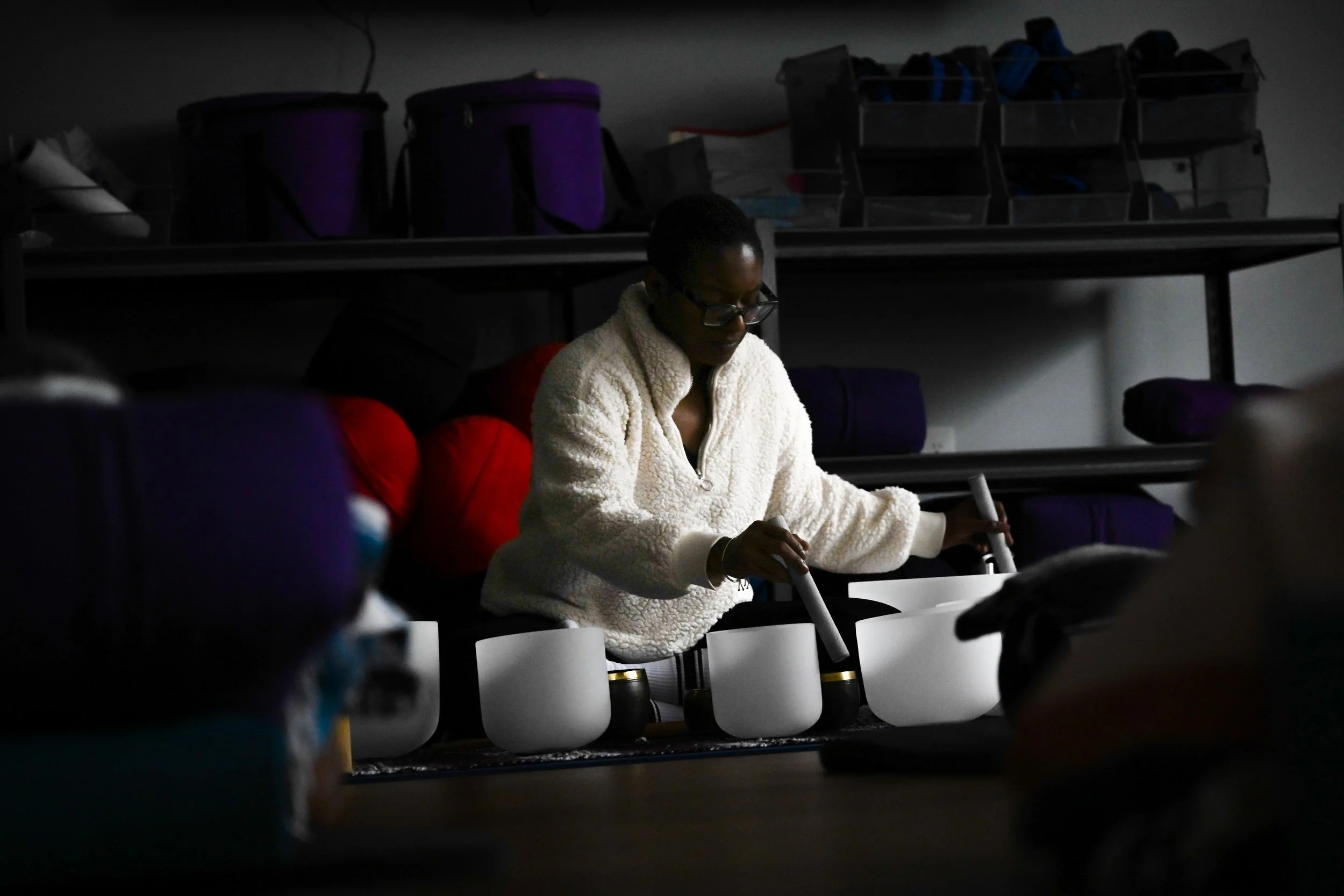 Uma Behati, a worker at Little Red Door Cancer Agency, performs a meditative sound bath for clients of the nonprofit Feb. 19 in Indianapolis.