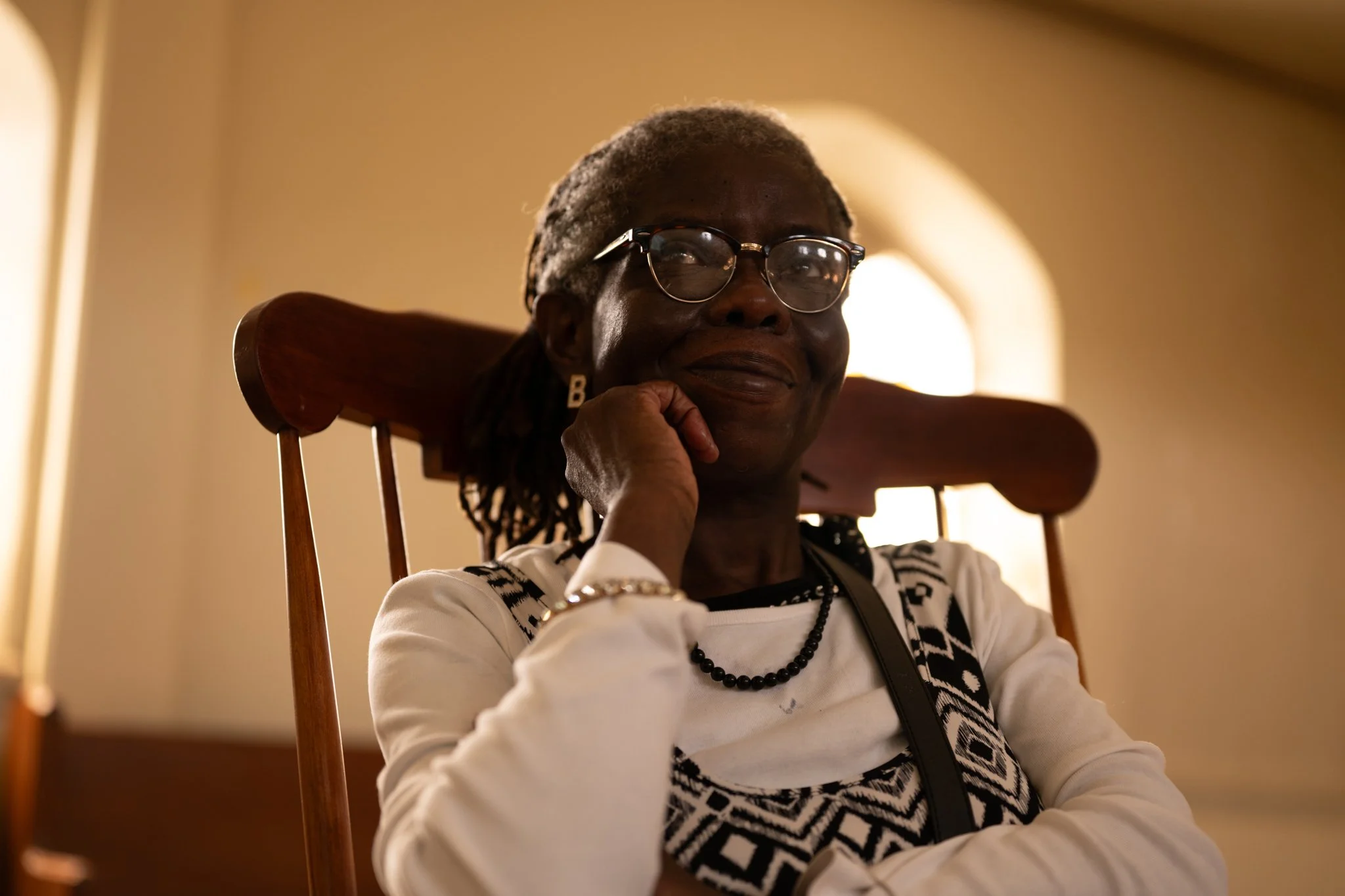 Recovery Cafe Muncie member Rosa Price watches as a volunteer gives a presentation April 3 in Muncie, Indiana.