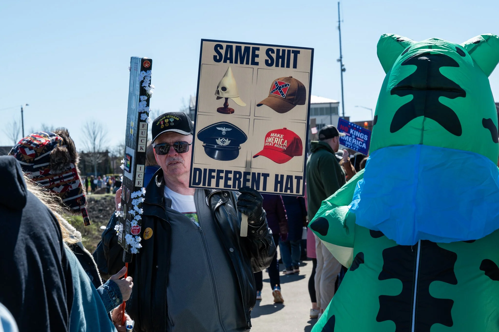 A Vietnam veteran holds a sign during the ‘No Kings 3’ protest March 28 at the Fallen Heroes Memorial Bridge. 