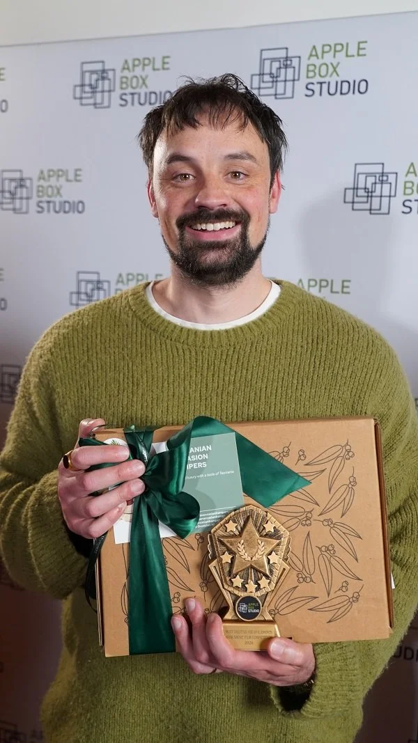 Adam with the hamper presented to him at the 48 Hour Short Film Competition