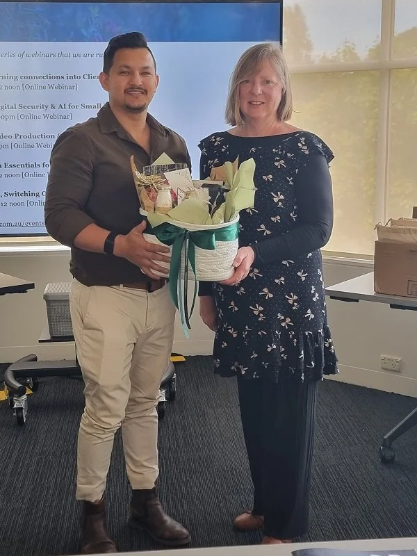 Gillian presenting the lucky door prize at the Small Business Success Summit to the lucky winner.