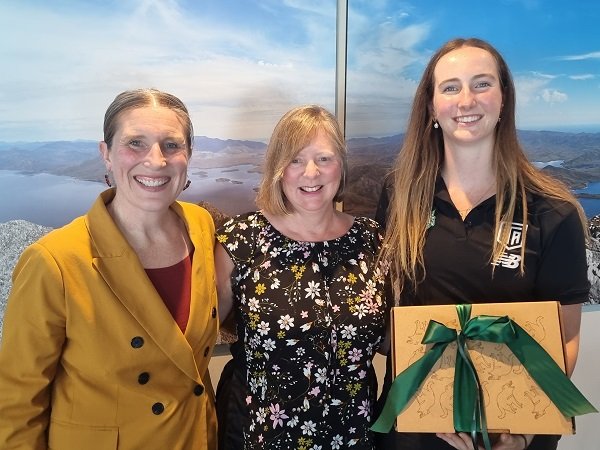 Kath McCann from the Tasmania Devils Football Club with Gillian and Alannah who is a TALS student.