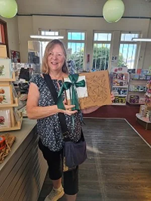 Gillian at the Lindisfarne Post Office posting off a hamper to the mainland
