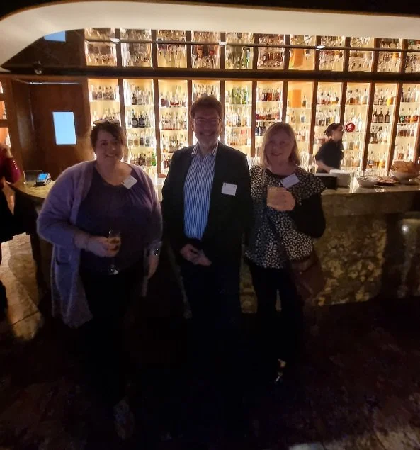 Ruth from She Rocks Digital, Mike from BNAA, and Gillian at TCCI Business Connect at the Evolve Spirit Bar at Mac1 in Hobart