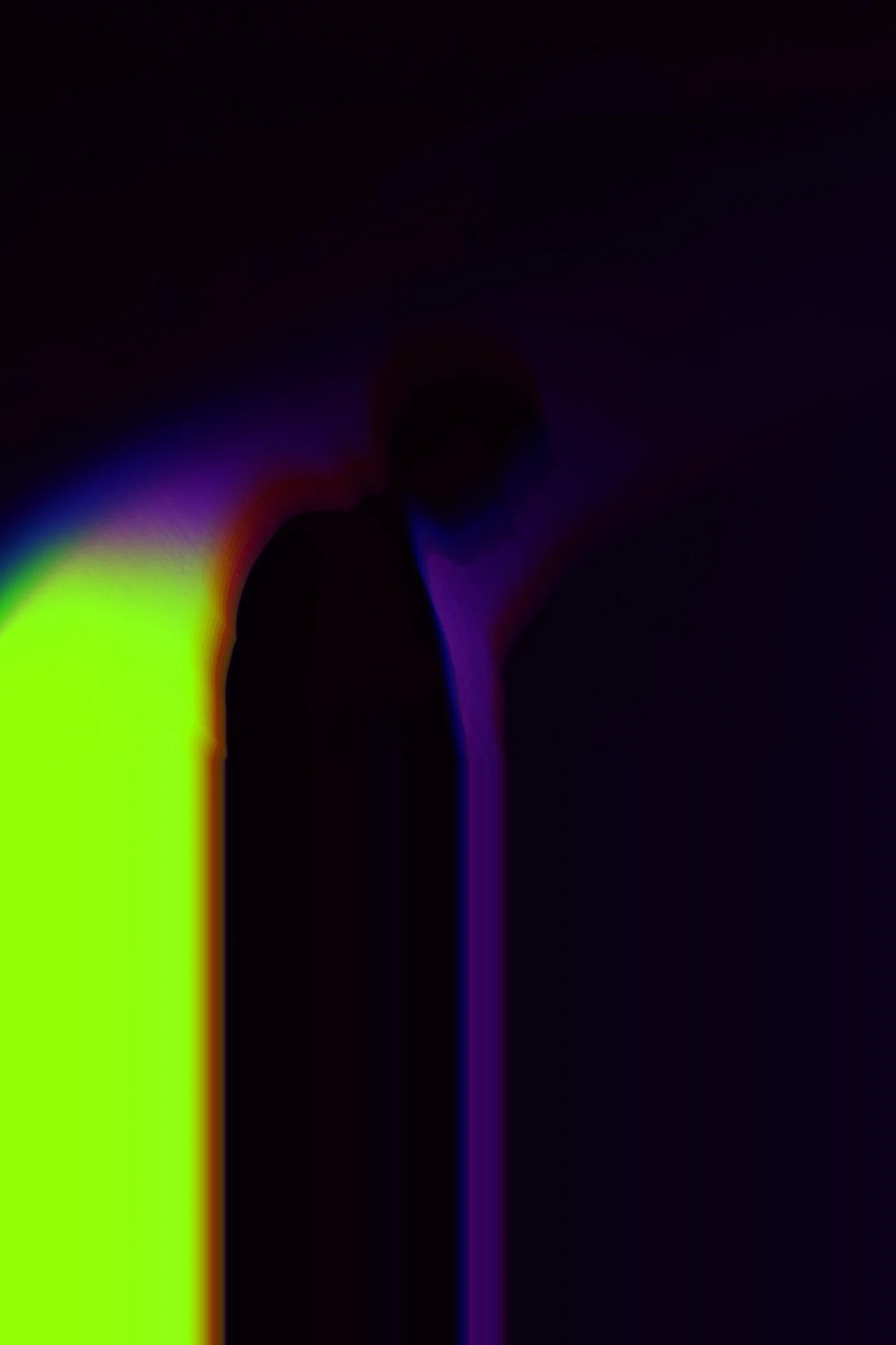 Silhouette of a person against a vibrant, multicolored background with neon colors blending in a gradient.