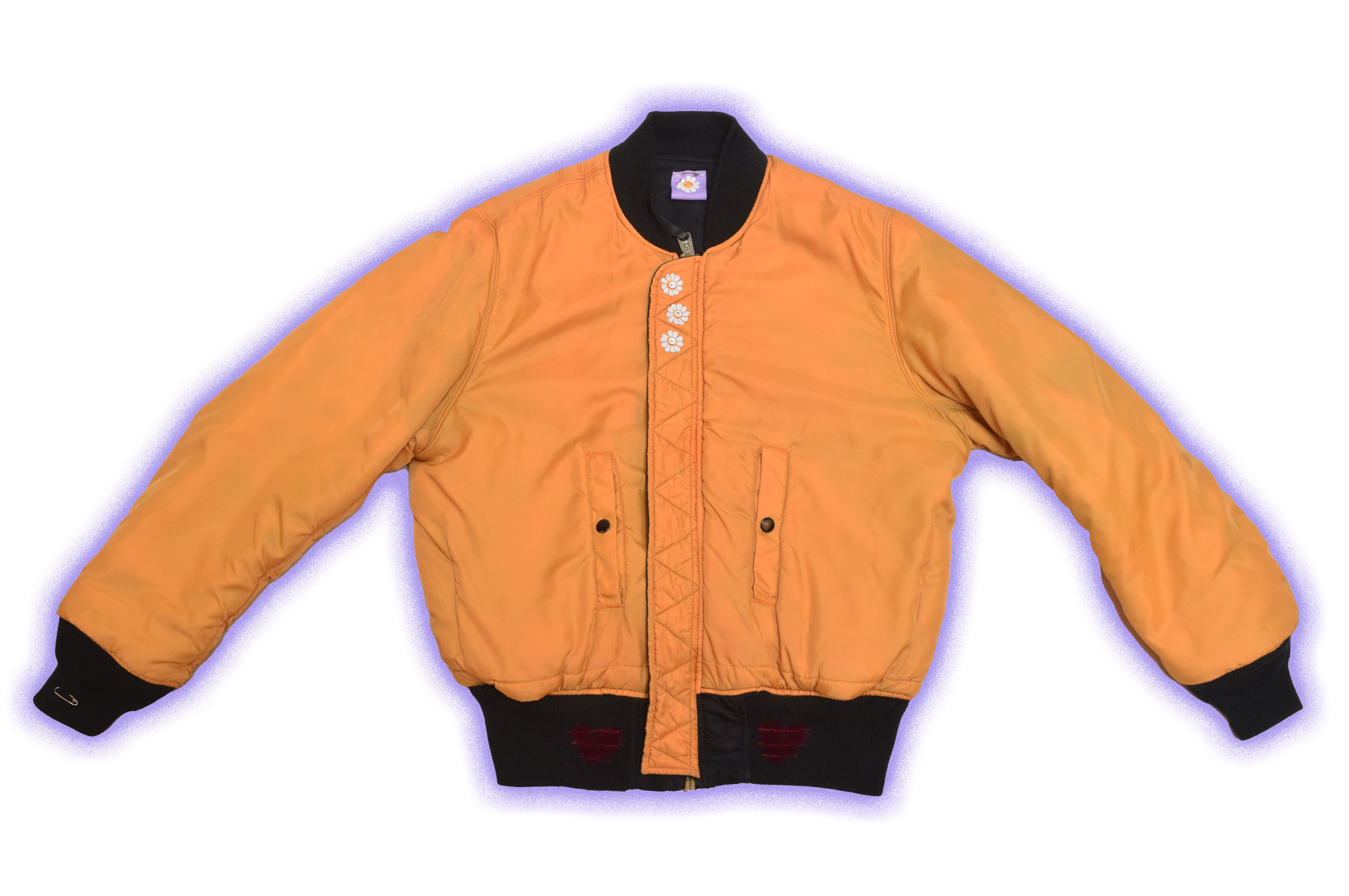 A yellow bomber jacket with black cuffs and collar, featuring embroidered daisies on the front and distressed patches on the sleeves.