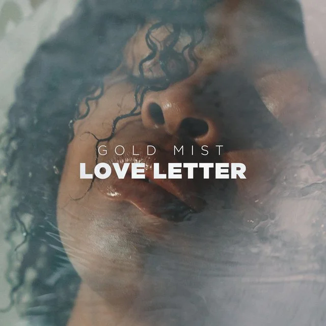 Close-up of a DĀHNI 's face partially submerged in water with wet curly hair, with text that says "LOVE LETTER"