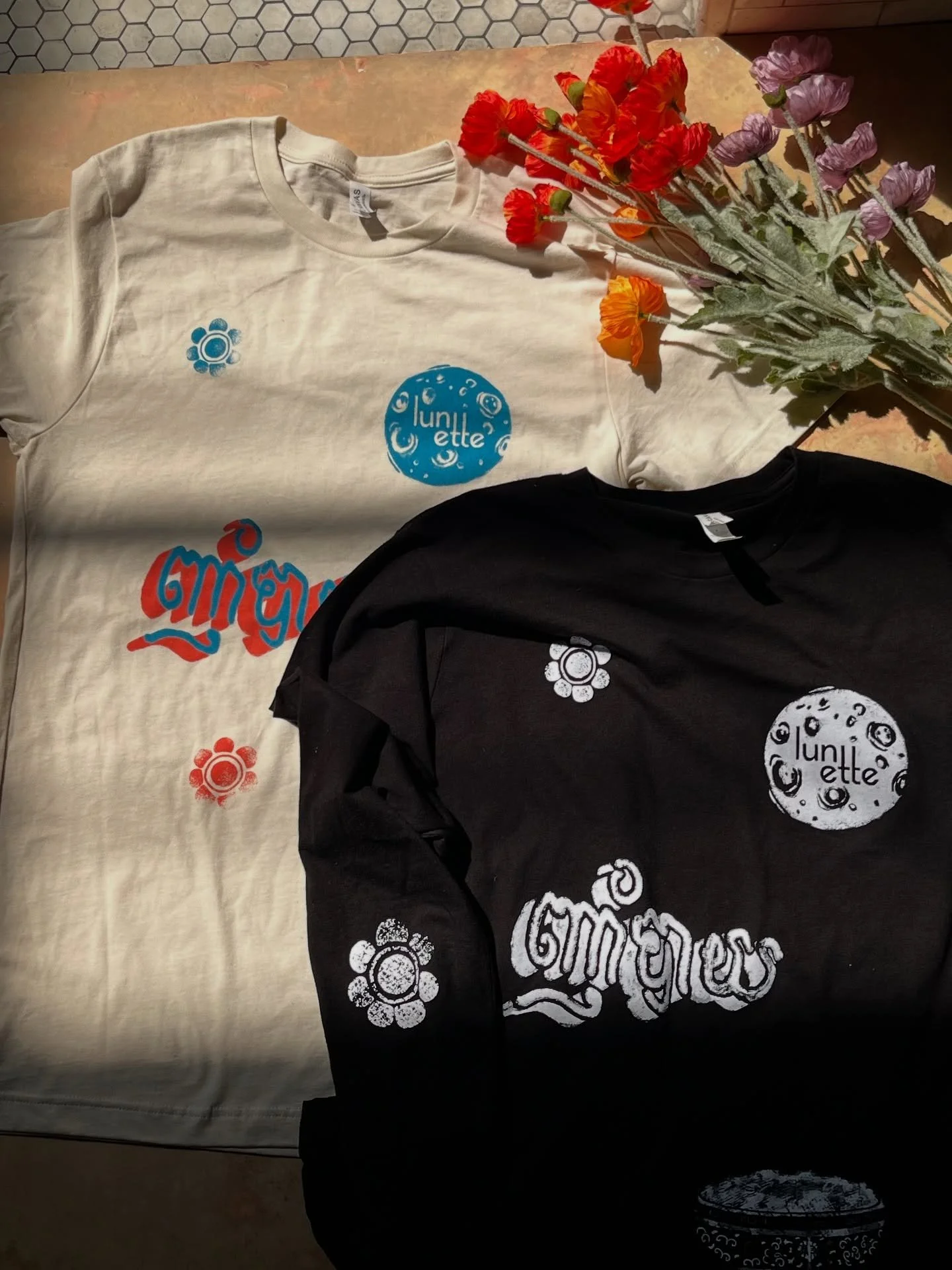 Merch restock! Stop on by the shop to pick up a cute new tee or tote. 💅