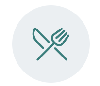 Icon of a fork and knife crossed in a circle.