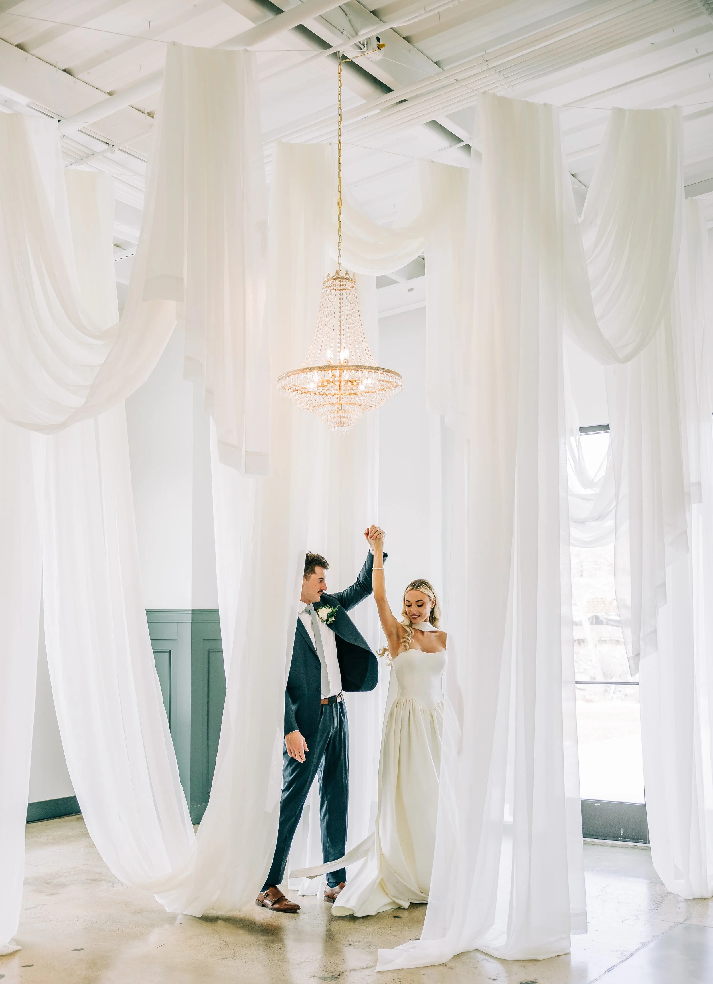 Fabric draping with French Empire Chandelier - Photography by Bella Alder