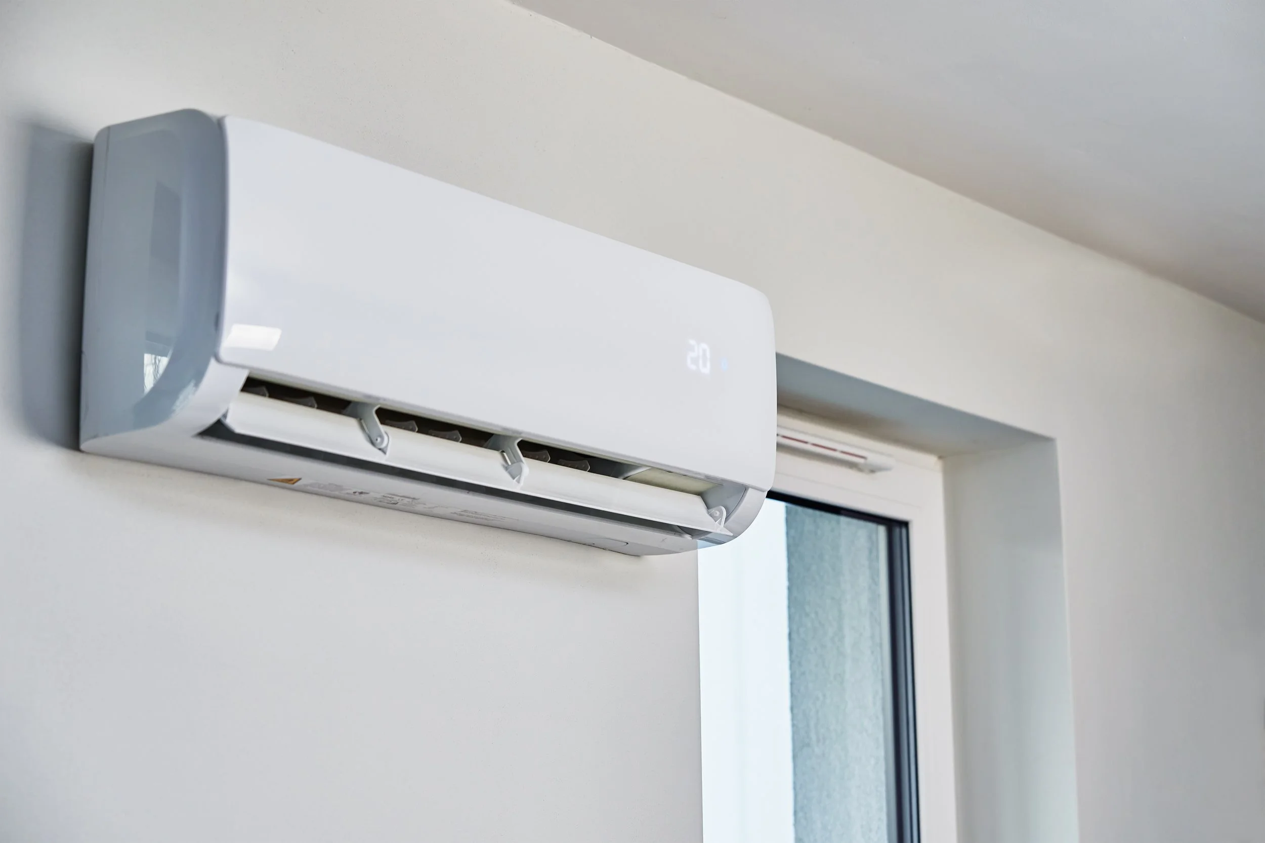 air-conditioner-hanging-on-the-wall-close-up-2023-11-27-05-31-07-utc.jpg