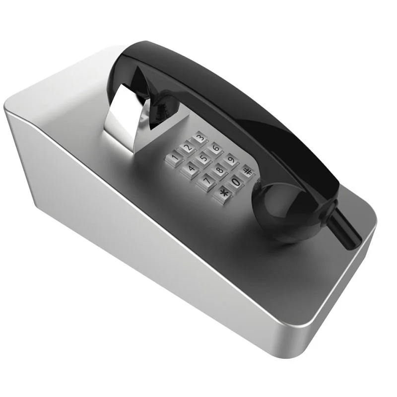 A black and silver landline telephone with a keypad and cord, placed on a silver base.
