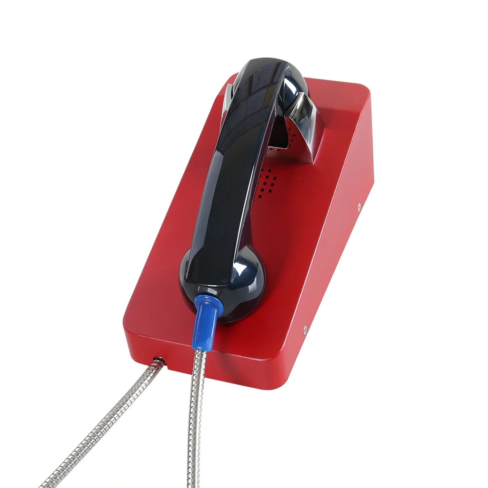 A red emergency call button with a push phone mounted on it.