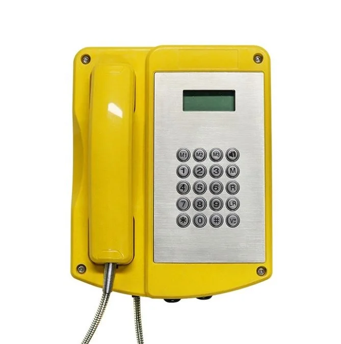 Yellow wall-mounted explosion proof telephone with a numeric keypad and a small digital screen.