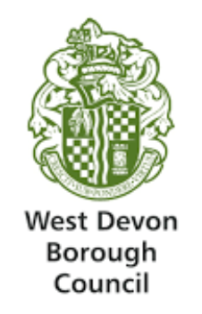 Emblem featuring a shield with checkered and animal symbols, topped by a crest, representing West Devon Borough Council.