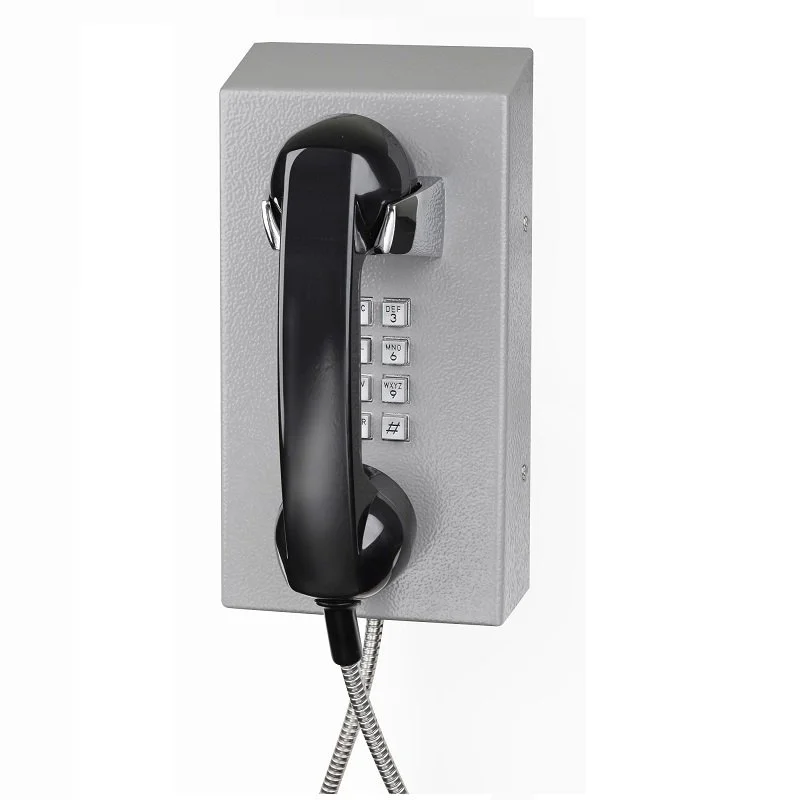 A wall-mounted industrial, robust telephone with a corded handset and keypad.