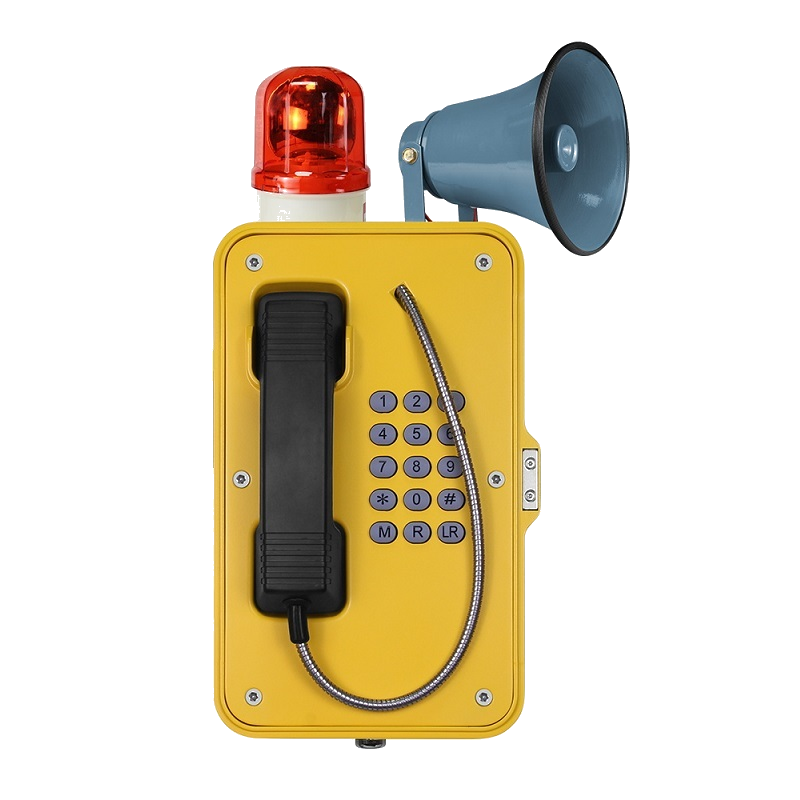 A yellow emergency telephone with a corded receiver, a keypad, a siren, and a megaphone attached. Emergency, factories, powerplants