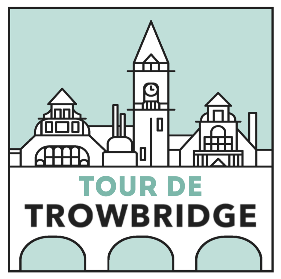 Illustration of a cityscape featuring Trowbridge Town Hall with the text "Tour de Trowbridge" below.