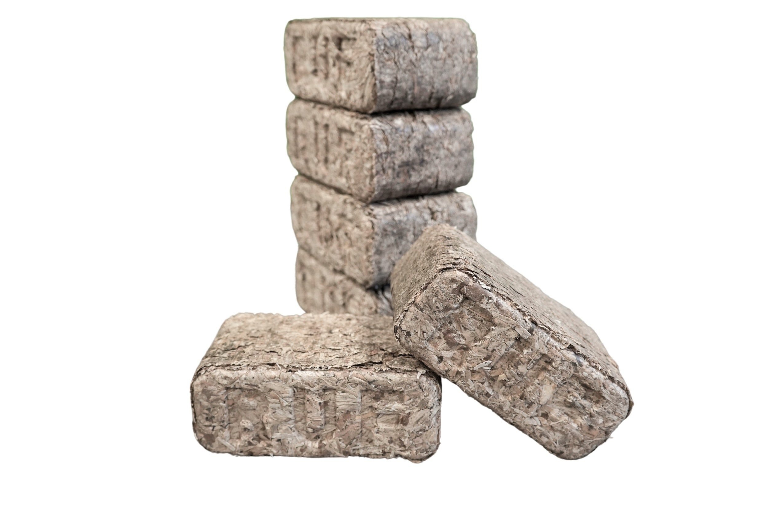 Close-up of softwood heat briquettes made from kiln-dried wood chips and bark for efficient burning