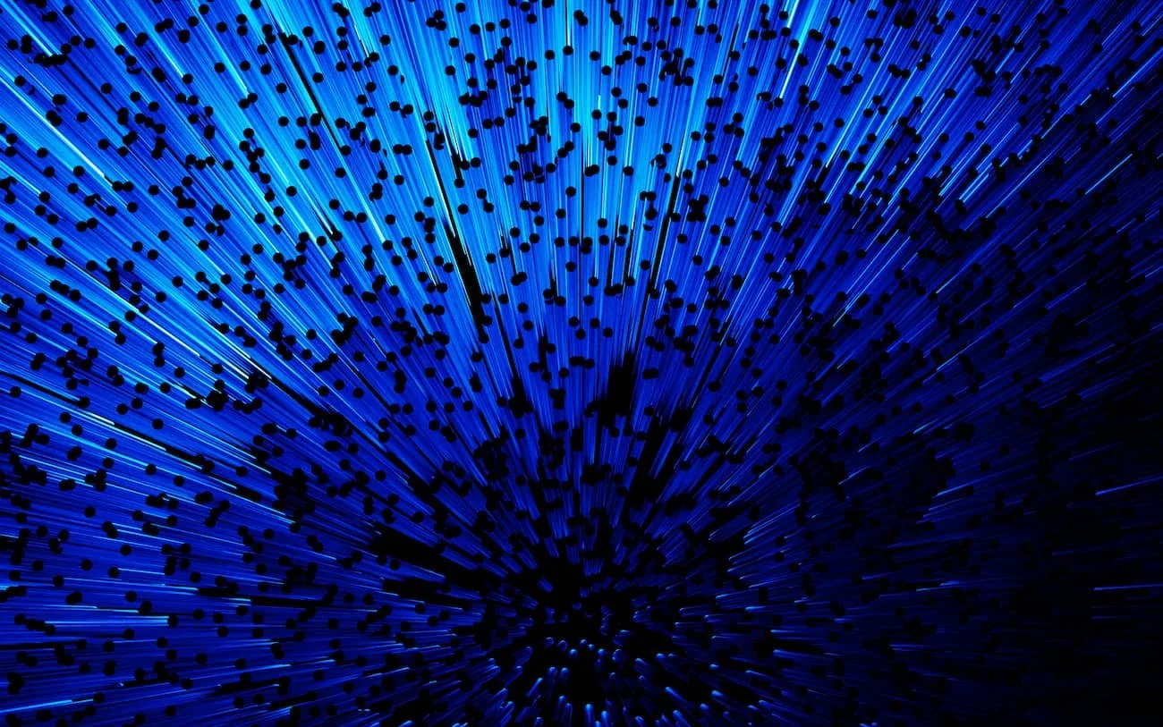 Blaue Lichter mit schwarzen Punkten, die in der Dunkelheit strahlen, in einer pysikalischen oder technologischen Darstellung.