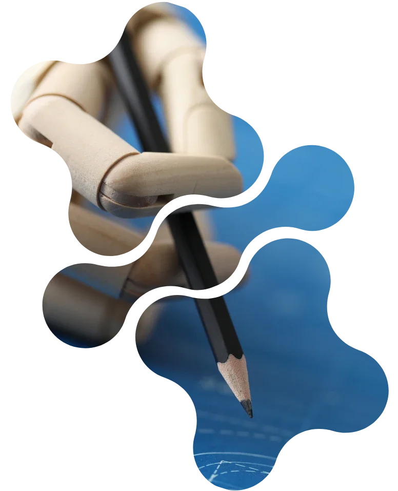 Eine Hand, die eine Bleistift hält, zeichnet auf eine blaue Fläche.