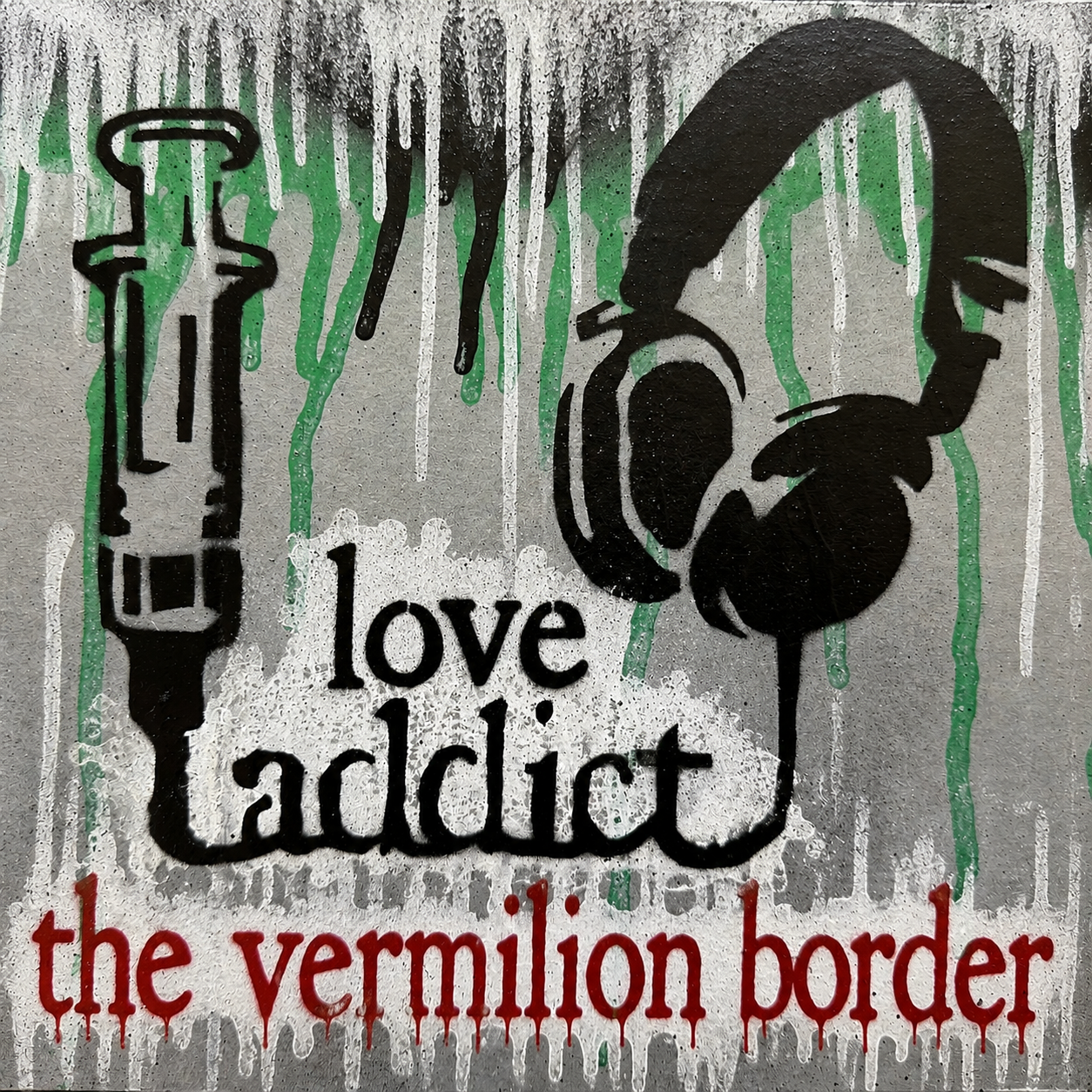 Street art graffiti featuring a syringe, a pair of headphones, and the phrase 'love addict' in black, with 'the vermilion border' written in red at the bottom, all with drips and paint splashes.