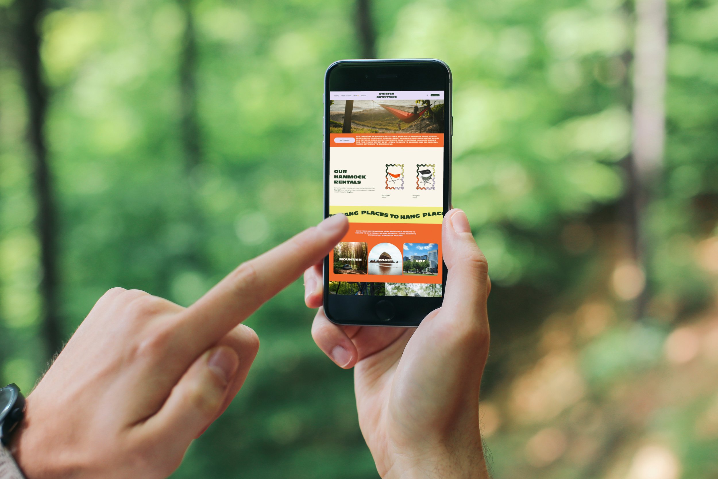 mockuuups-pointing-on-iphone-6-mockup-in-the-forest.jpeg