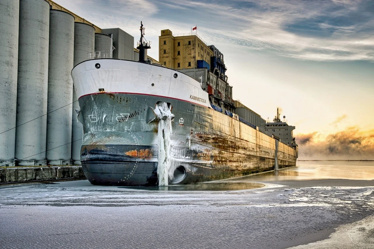 An icy grain ship docks at the grain elevators on Lake Superior in Thunder Bay