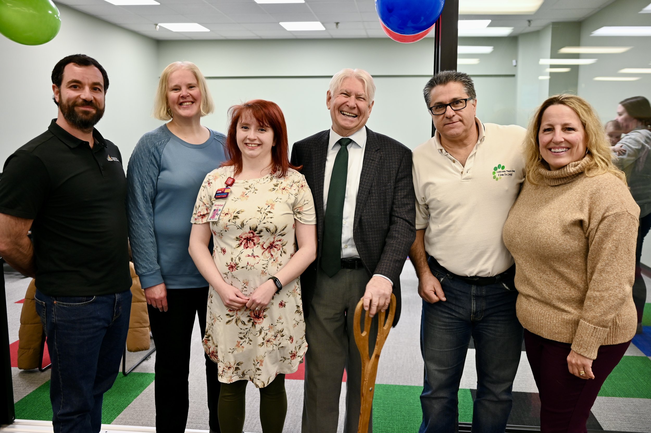 Library staff and city officials at a ribbon cutting ceremony to unveil the new addition at County Park Library