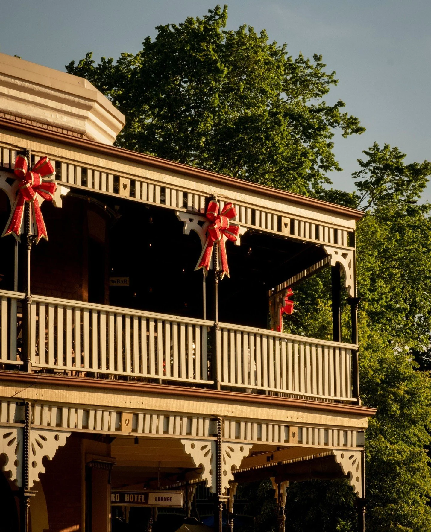 As December 1 arrives, the bows will return to the balcony, and with them comes a full month of celebrations. Live music drifting out onto the street, long lunches upstairs, Christmas parties filling every corner, and the Village Christmas Party read