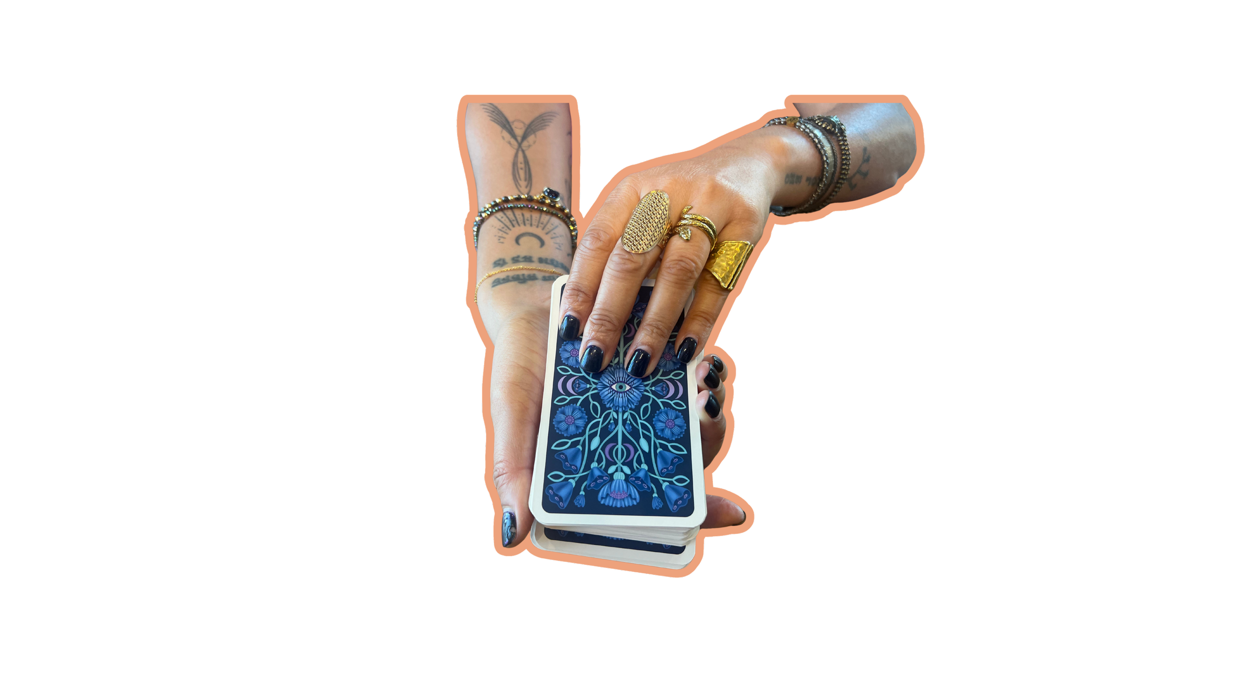 Hands decorated with multiple rings and bracelets holding a tarot card with a blue floral design.
