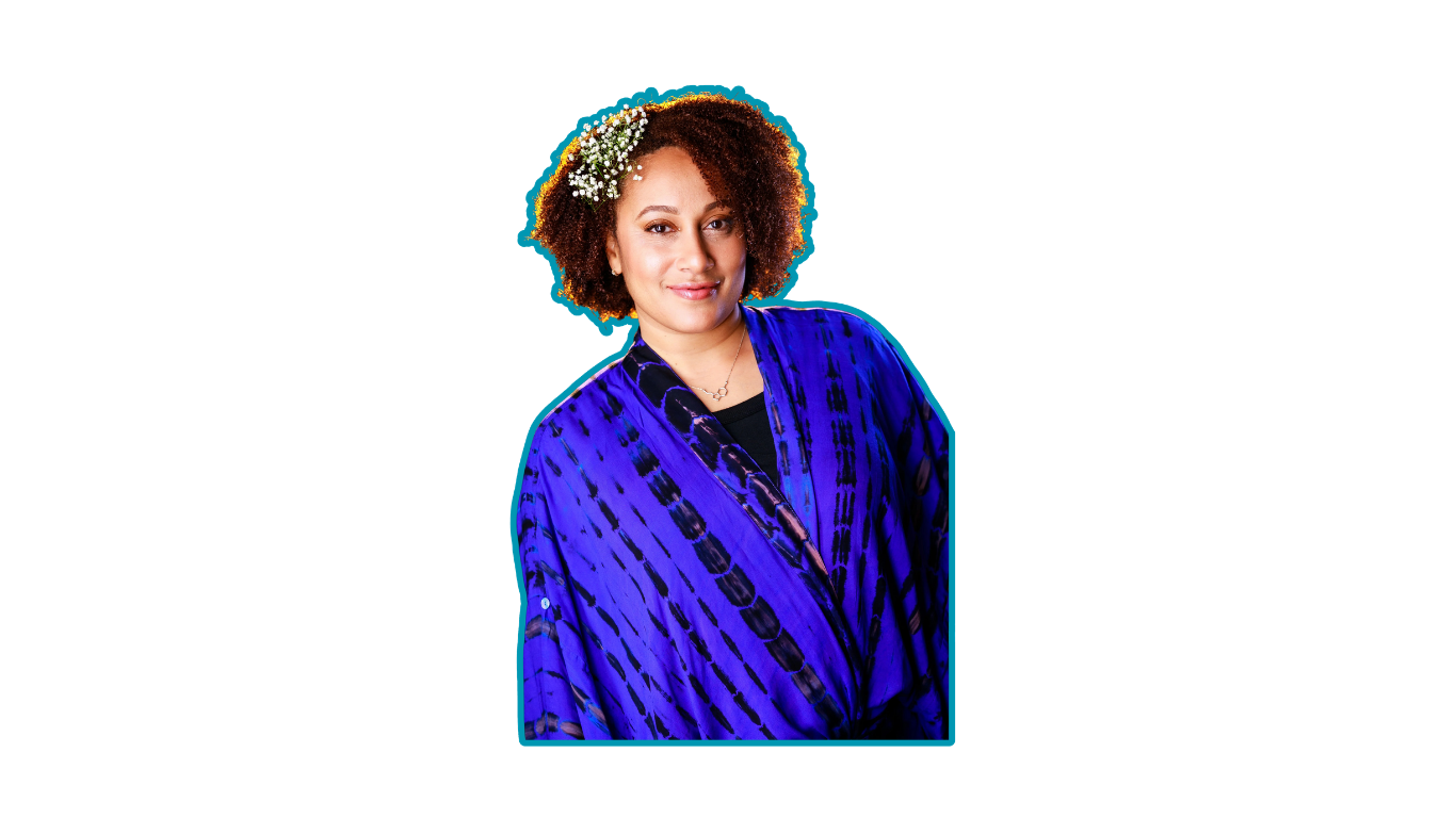 A woman with curly hair wearing a blue patterned kimono and a floral headband, smiling at the camera against a solid black background with blue graphic elements.