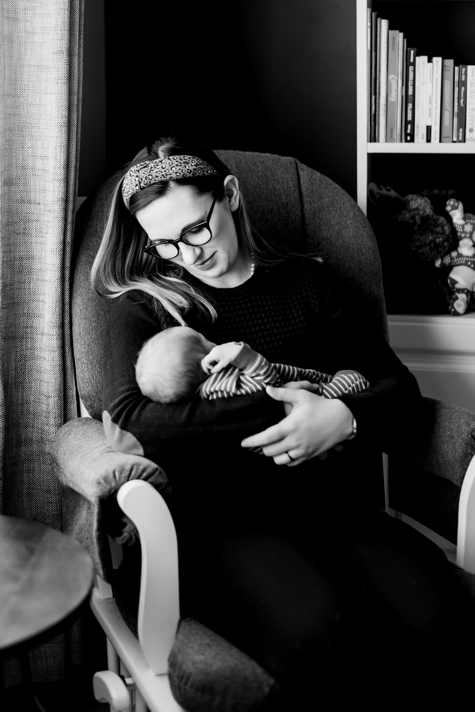 Photo of Alanna Betts, a mother, looking a her newborn baby