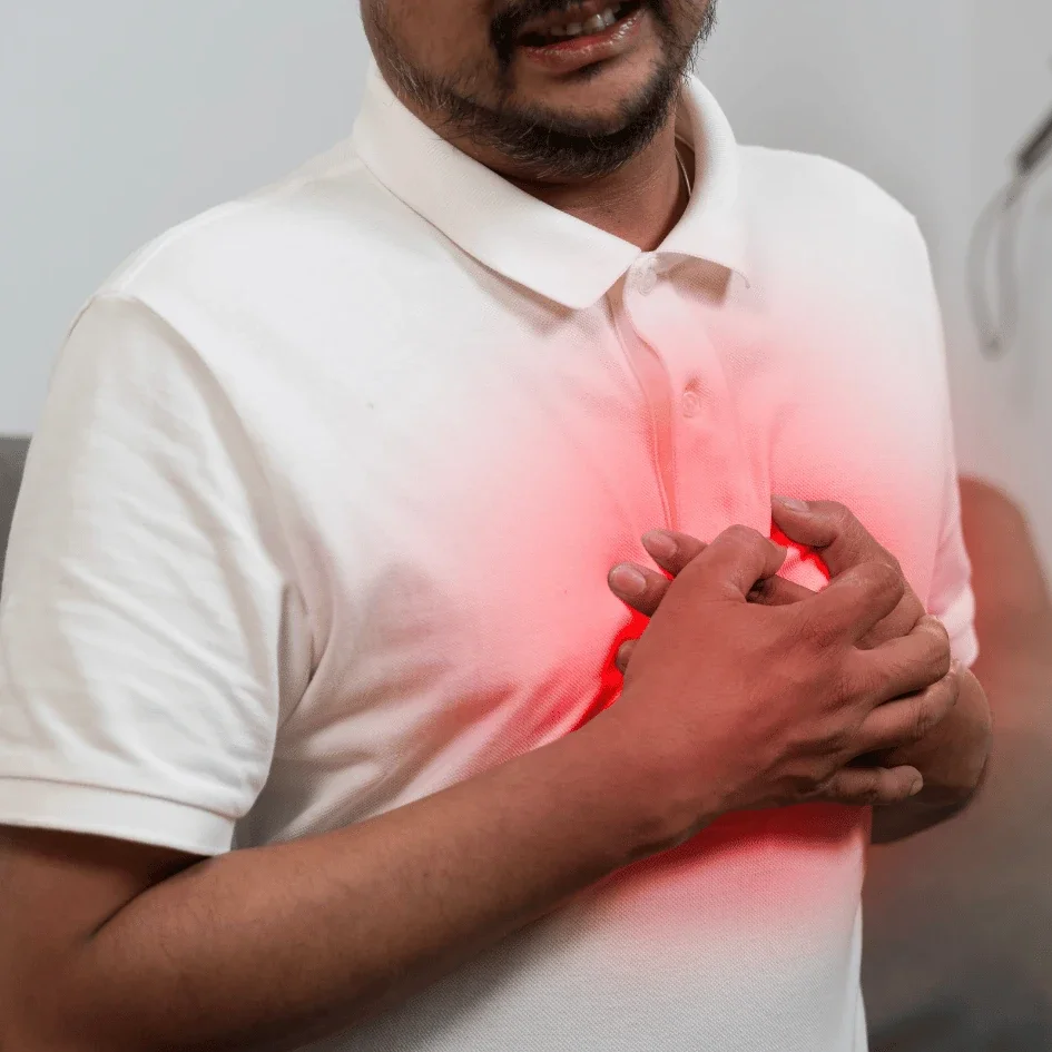 Man holding his chest due to tachycardia