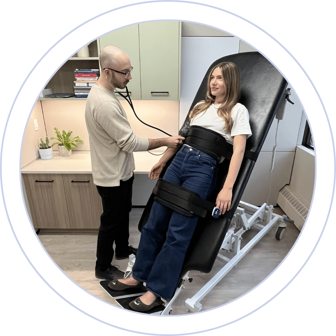 Female patient getting her vitals checked while performing tilt table testing