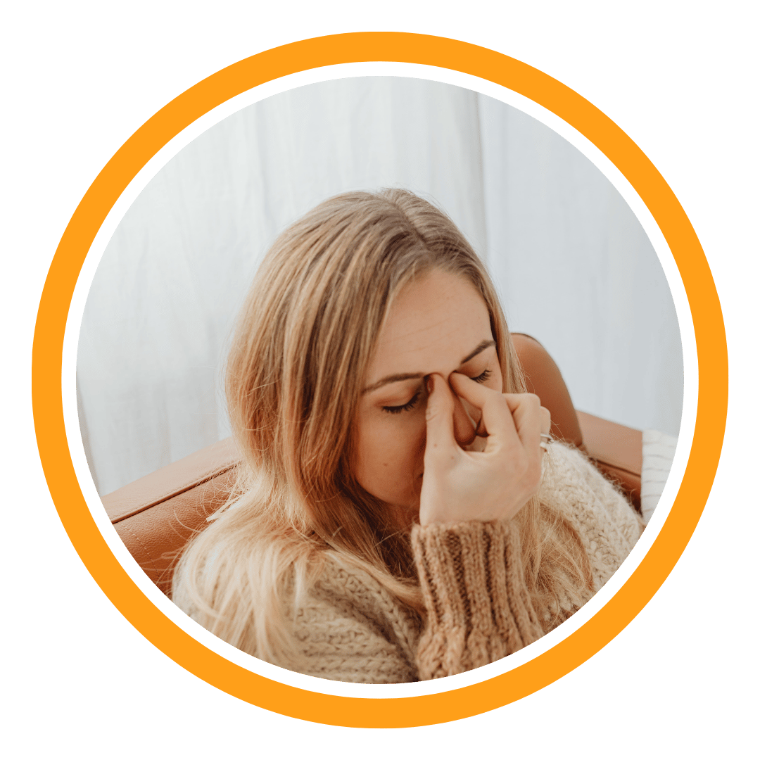 Woman holding her nose because of pain