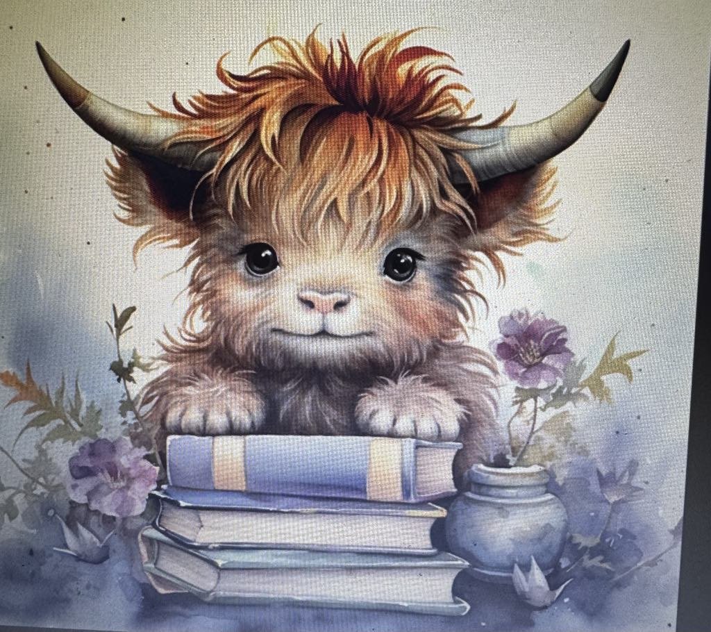 Cow on books.jpg