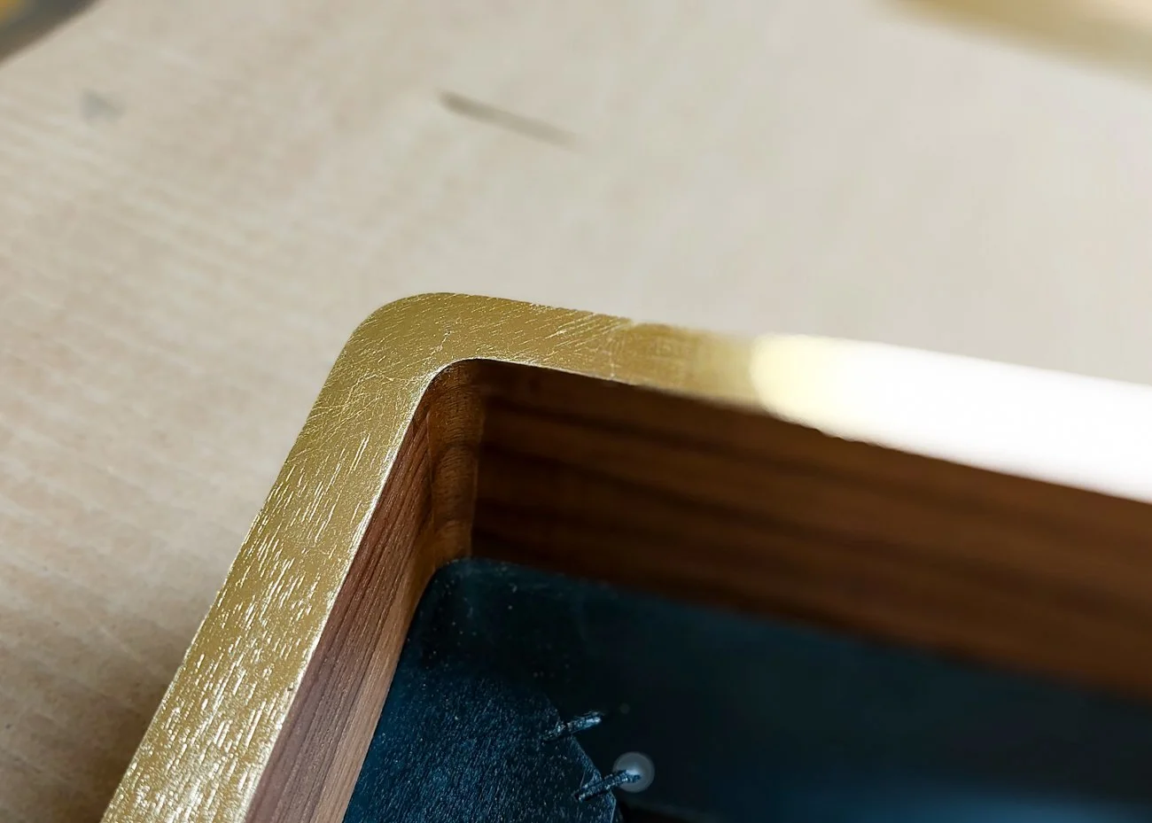 Gold leaf face walnut frame with rounded corners 