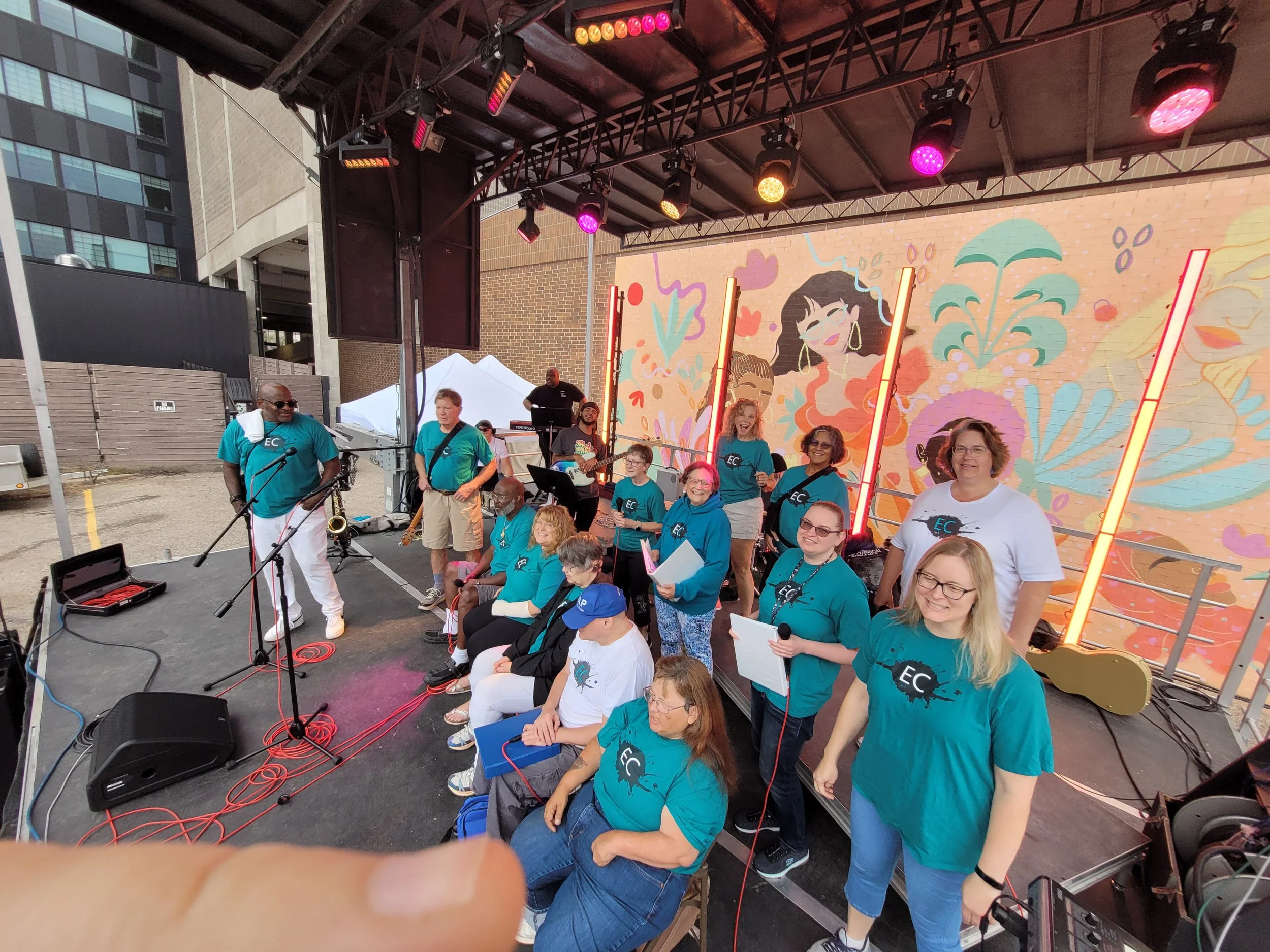collective choir at fall fest 2024 on the main stage with singers and musicians playing gospel and hip hop music in Eau Claire, WI